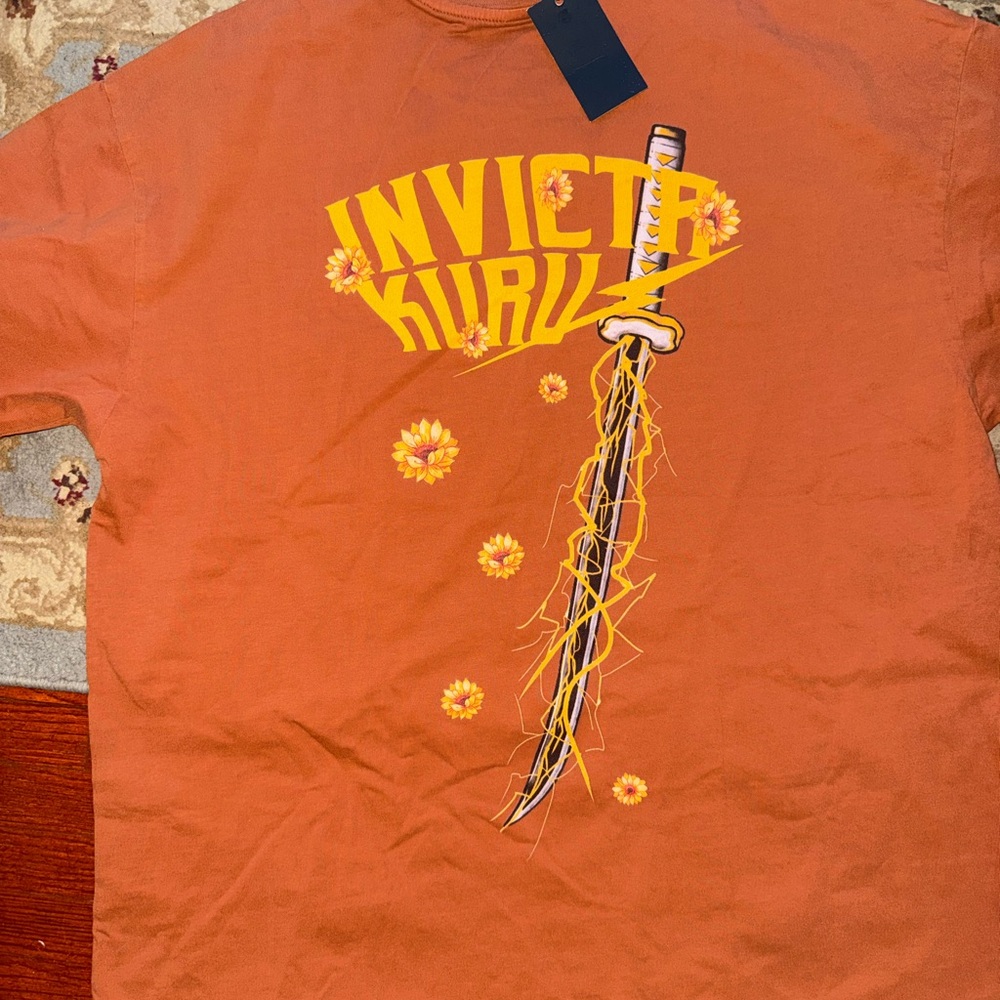 Invicta Men's Orange Tee with Sword Graphic